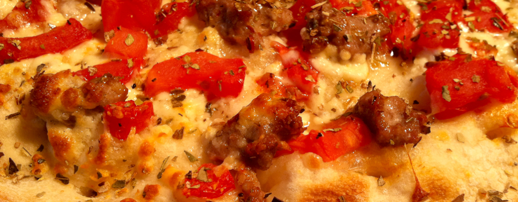 Our Napoletana Pizza is a huge favourite.  Try it today – you’ll fall in love! (Pictured with sausage)